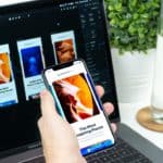 person holding iPhone turned on