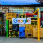 google logo beside building near painted walls at daytime