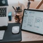 macbook pro beside apple magic mouse