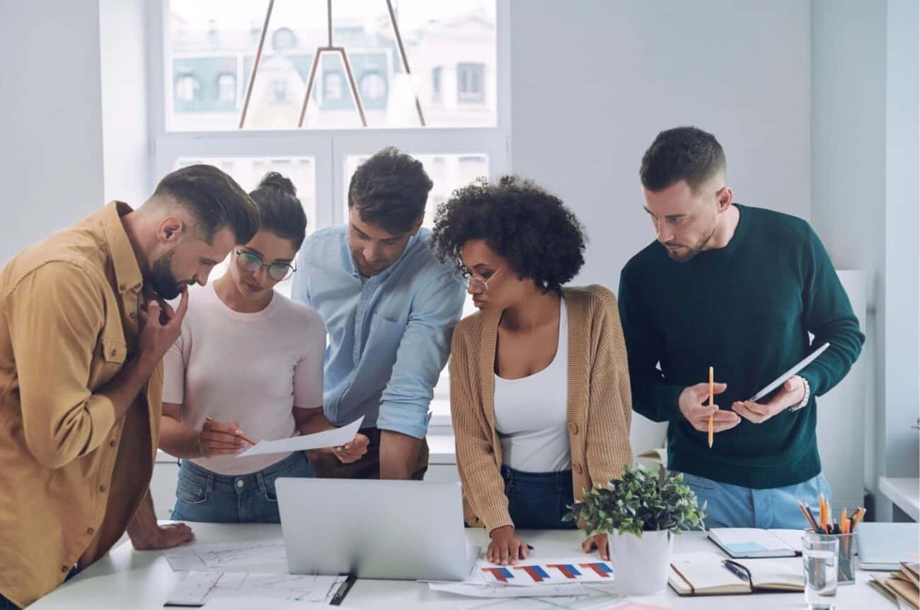 A creative team revising ideas brought by AI